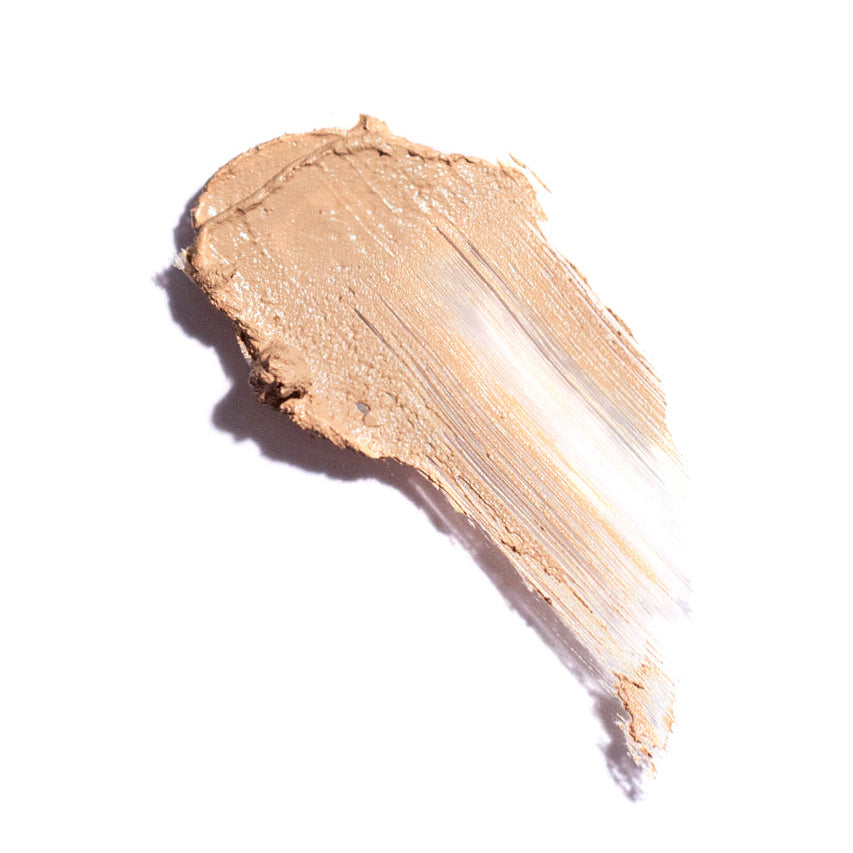 Close-up of a beige makeup swatch on a white background